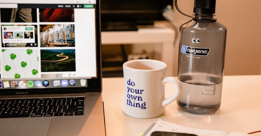 cozy-workspace-with-laptop-motivational-mug-and-water-bottle-perfect-for-remote-work-inspiration