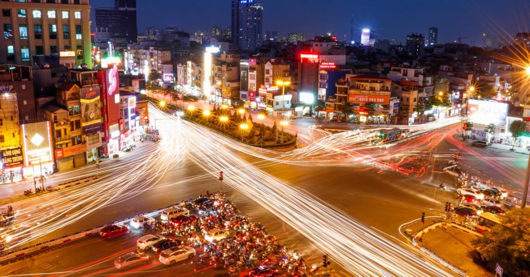 vibrant-long-exposure-shot-of-a-busy-hanoi-intersection-at-night